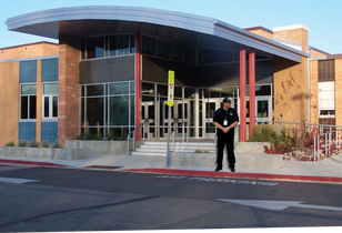 Security guard outside school entrance