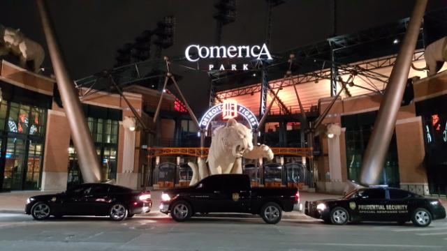 Diplomatic Treasury Reserve vehicles parked out front of Comerica Park