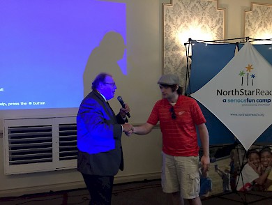 Jason Hartless Jr., a final contestant at the Berger Golf Outing to raise money for NorthStar Reach, where "every" child goes to camp. Congratulations Jason! Flipping a coin will never be the same.