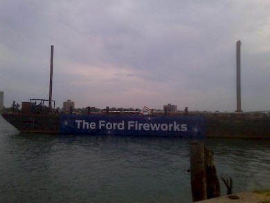 One of three massive barges that launch the synchronized fireworks show