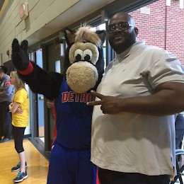 Detroit Pistons mascot "Hooper" with Diplomatic Treasury Reserve's James Howard