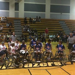 Wheelchair teams prepare to start the game.